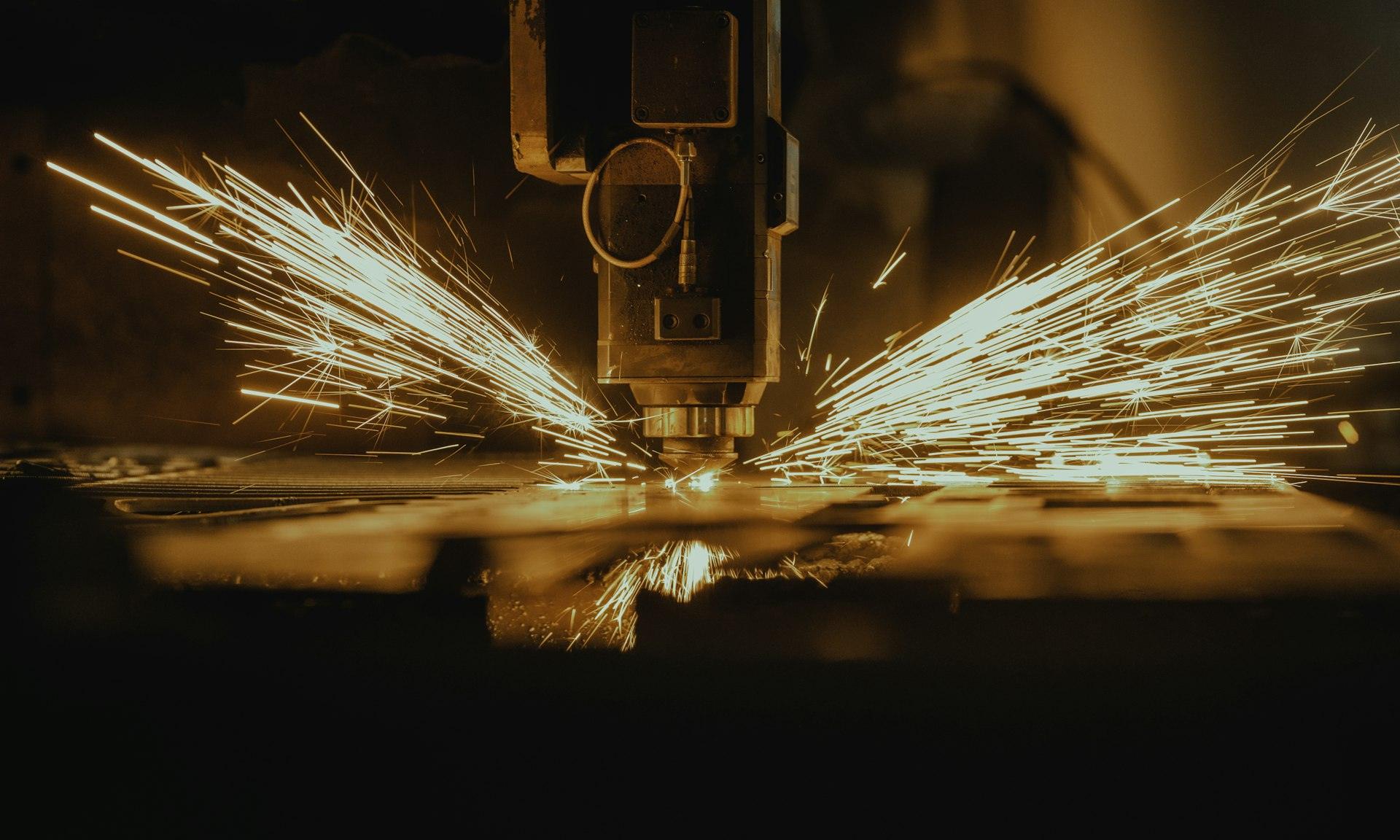 Fiber laser cutting with sparks